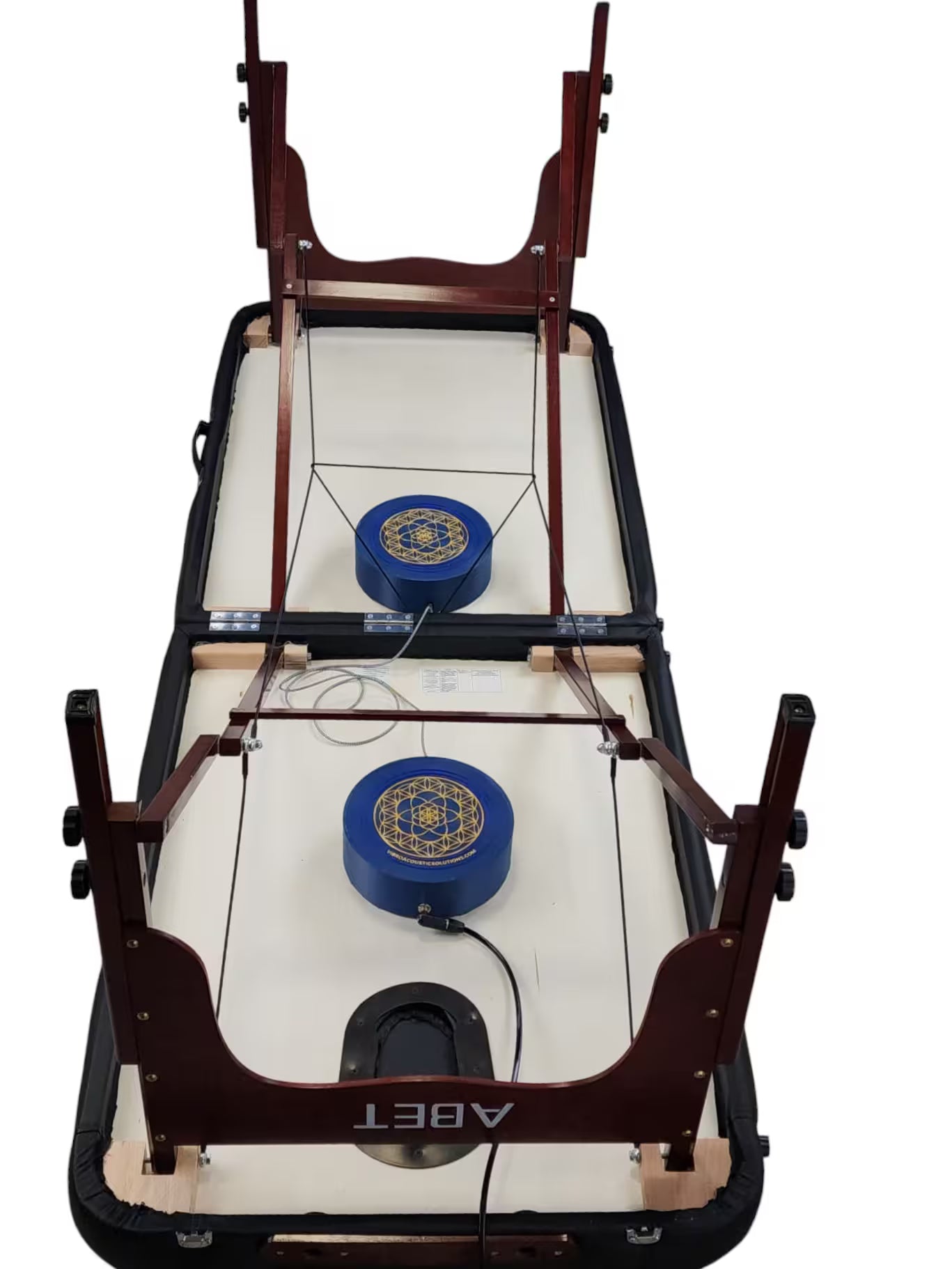 Vibroacoustic therapy massage table attachments showcasing  placement of attachments on the table to allow portable massage table to close, designed to enhance massage practices.