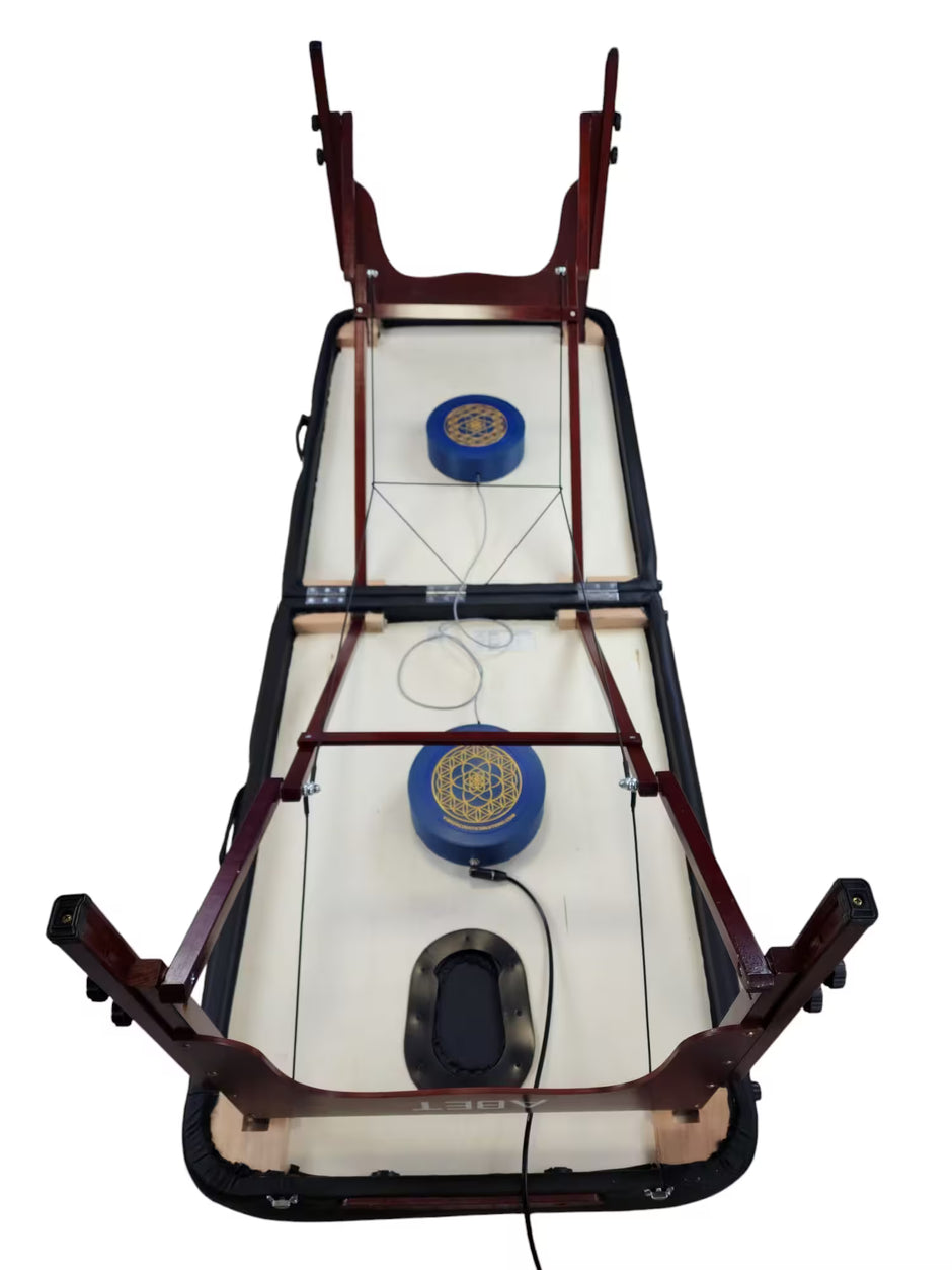 Vibroacoustic therapy massage table attachments showcasing  placement of attachments for stationary massage table, designed to enhance vibrations during massage practices.